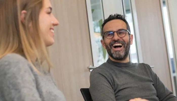 Man and woman laughing